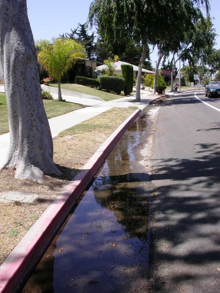 Water runoff down a street gutter